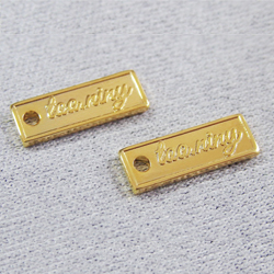 アクセサリープレート　ブランドプレート　too.niny 様　真鍮製／光沢金メッキ／金型刻印